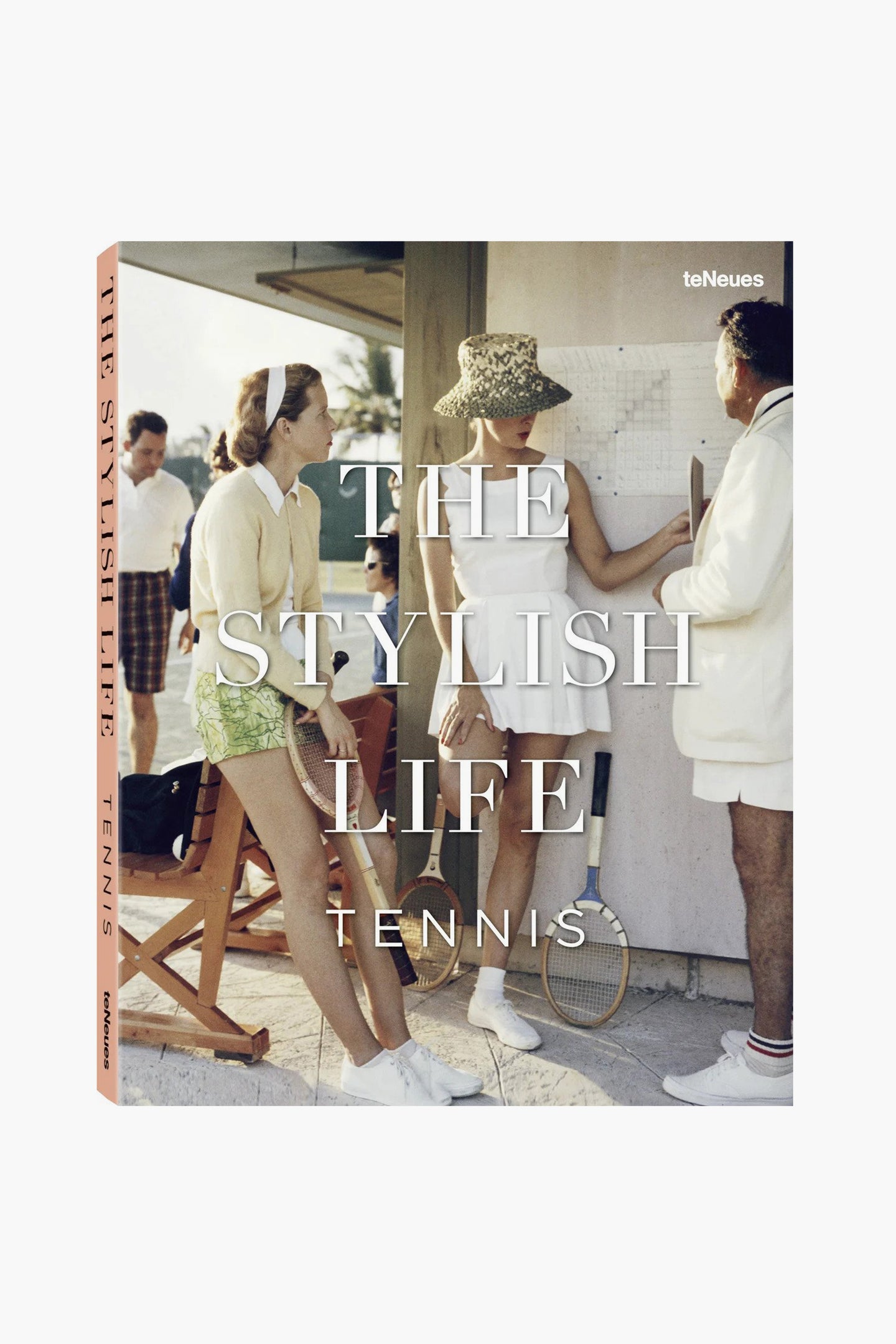 Three people in vintage tennis attire stand together, one writing on a board. A tennis racket and chairs are nearby. The Teneues book cover reads "The Stylish Life: Tennis," celebrating the tennis lifestyle and illustrated books.