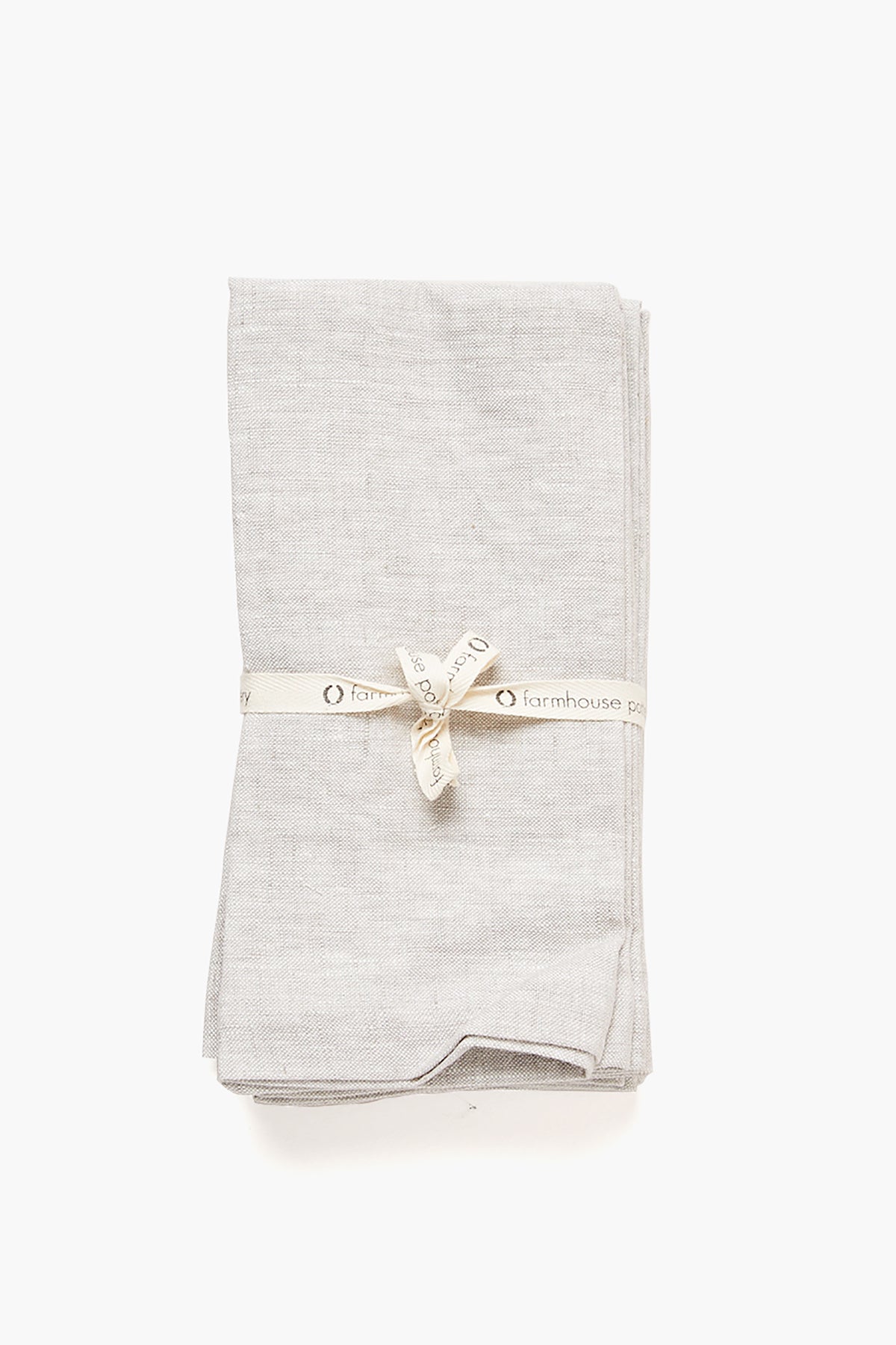 Stone Washed Linen Napkins, a classic and high-end set of four, effortlessly bundled with a branded “farmhouse” ribbon, offering fun and easy elegance for any dining occasion.