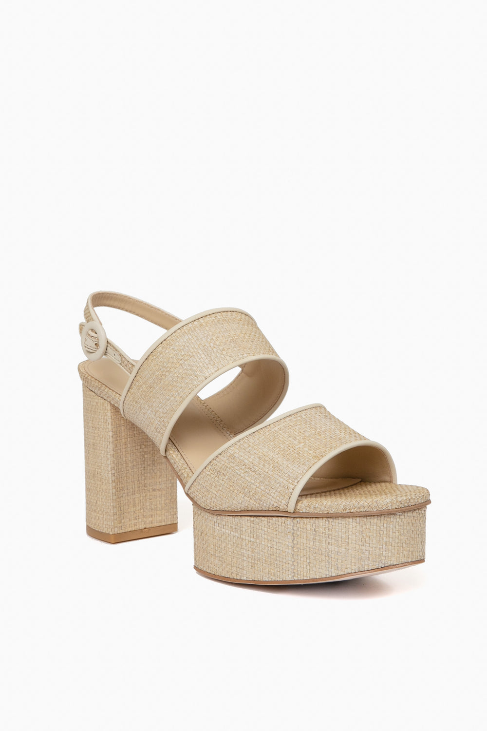 Beige platform sandal by Cult Gaia with thick block heel, two wide straps, adjustable ankle strap with buckle, and a textured woven pattern for a chic look.