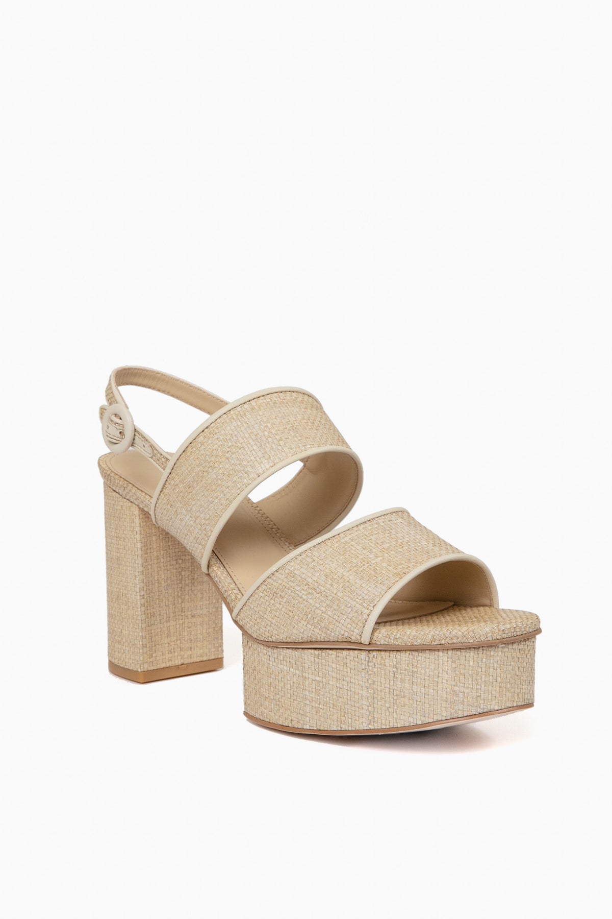 Beige platform sandal by Cult Gaia with thick block heel, two wide straps, adjustable ankle strap with buckle, and a textured woven pattern for a chic look.