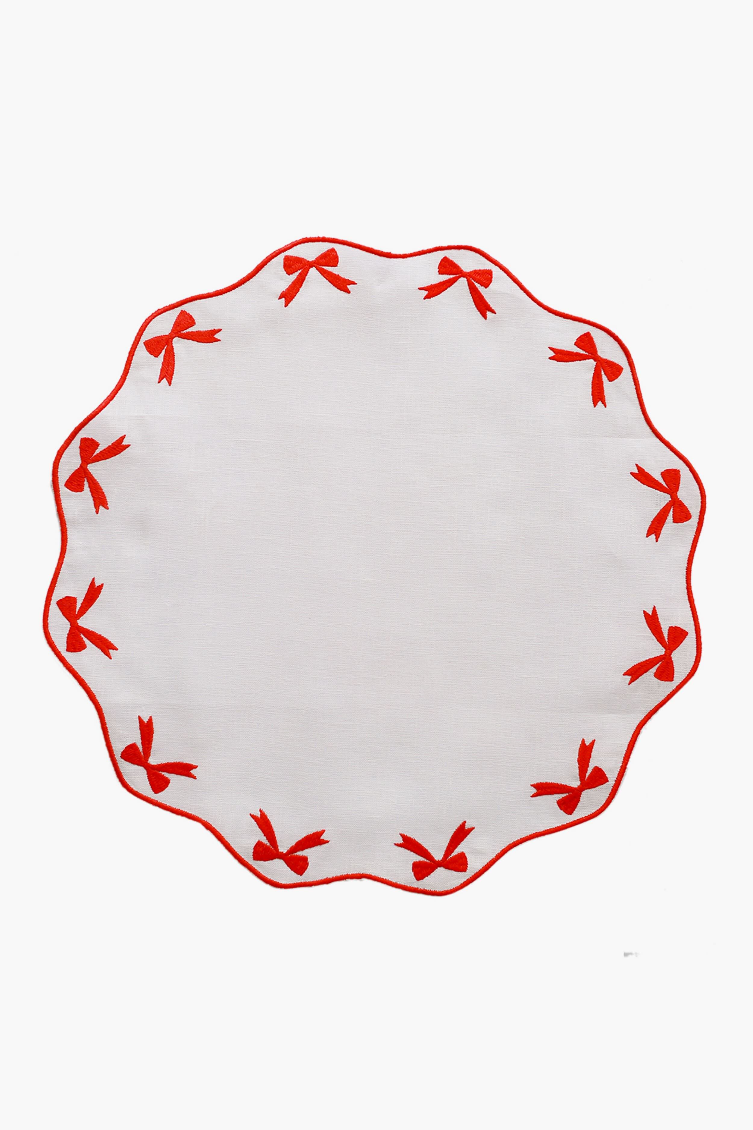 Chefanie round white linen placemat with scalloped edge, red embroidered bows around the border—a charming hostess gift.