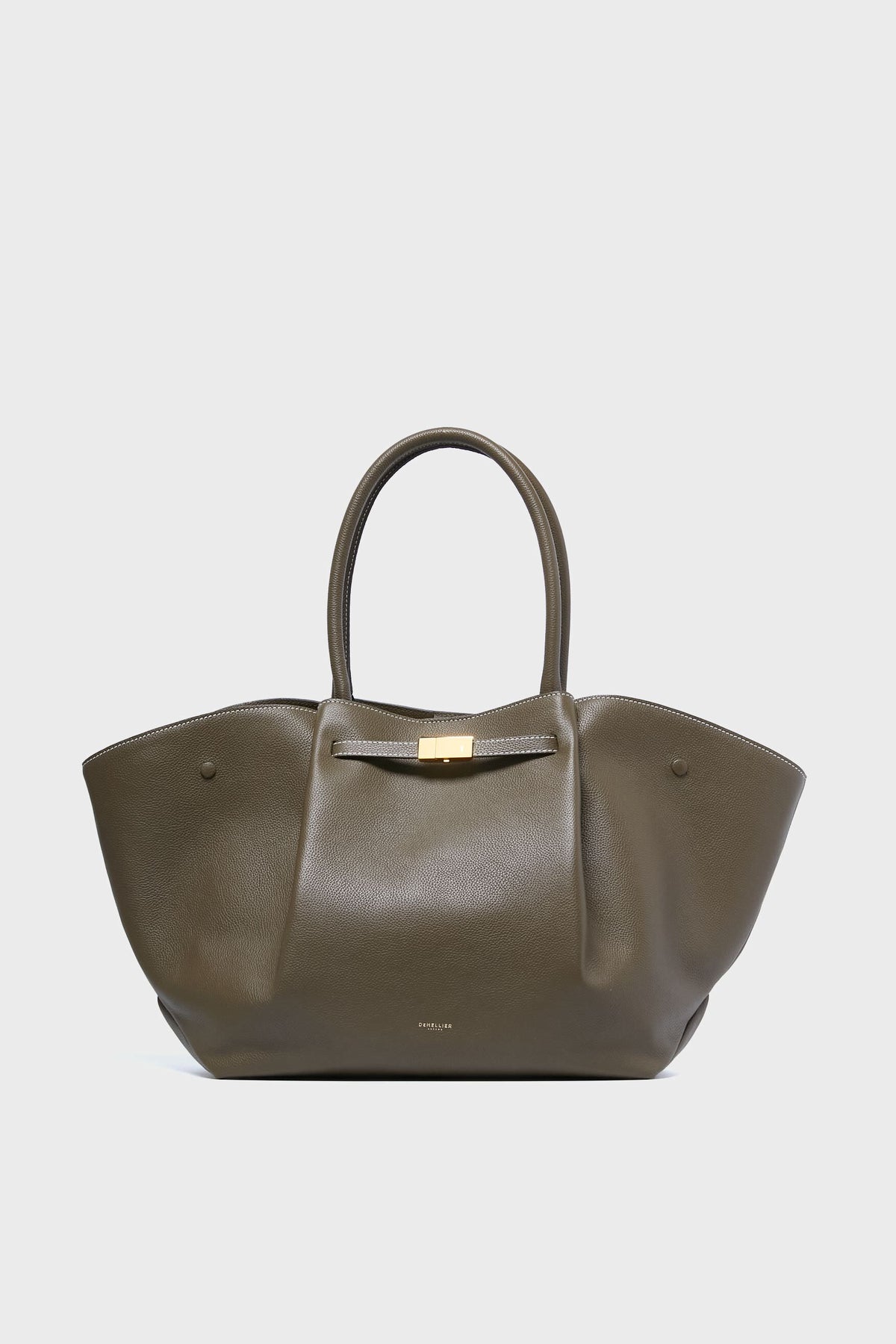 The Demellier olive green handcrafted leather tote features two rounded handles, winged sides, and a gold-tone clasp—a stylish, sustainable accessory for eco-conscious fashion lovers.