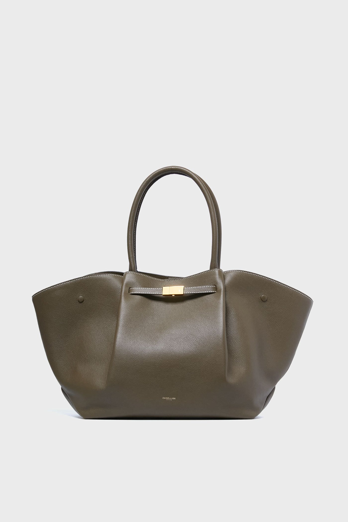 The Demellier olive green handcrafted leather tote features two rounded handles, winged sides, and a gold-tone clasp—a stylish, sustainable accessory for eco-conscious fashion lovers.