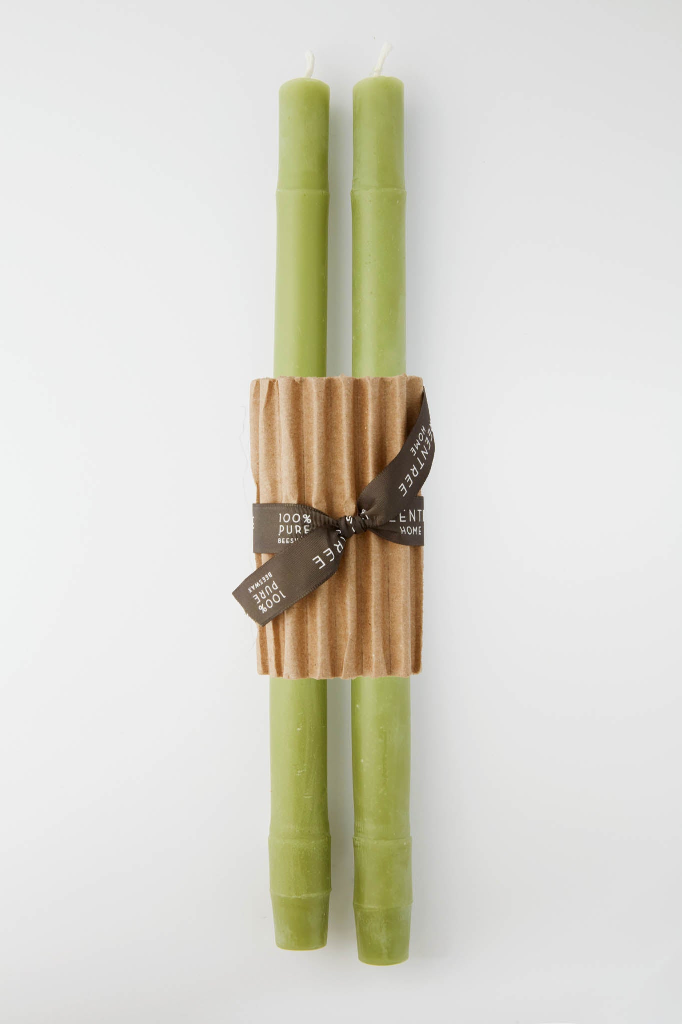 Greentree Home's two green bamboo taper candles, crafted to mimic real bamboo, come bundled with corrugated cardboard and a brown 100% pure ribbon—ideal handcrafted accents for any space.