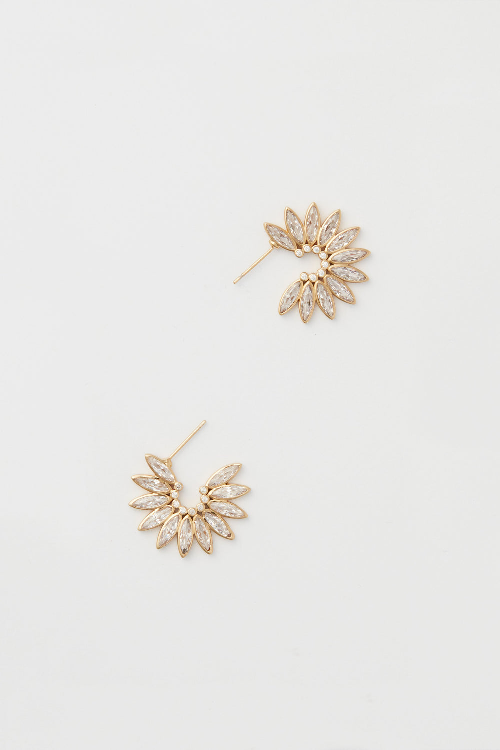 The Mignonne Gavigan Ines Earrings feature a fan-shaped design in 14k gold-plated finish, each accented with multiple marquise-shaped crystals arranged in a sparkling semi-circular pattern.