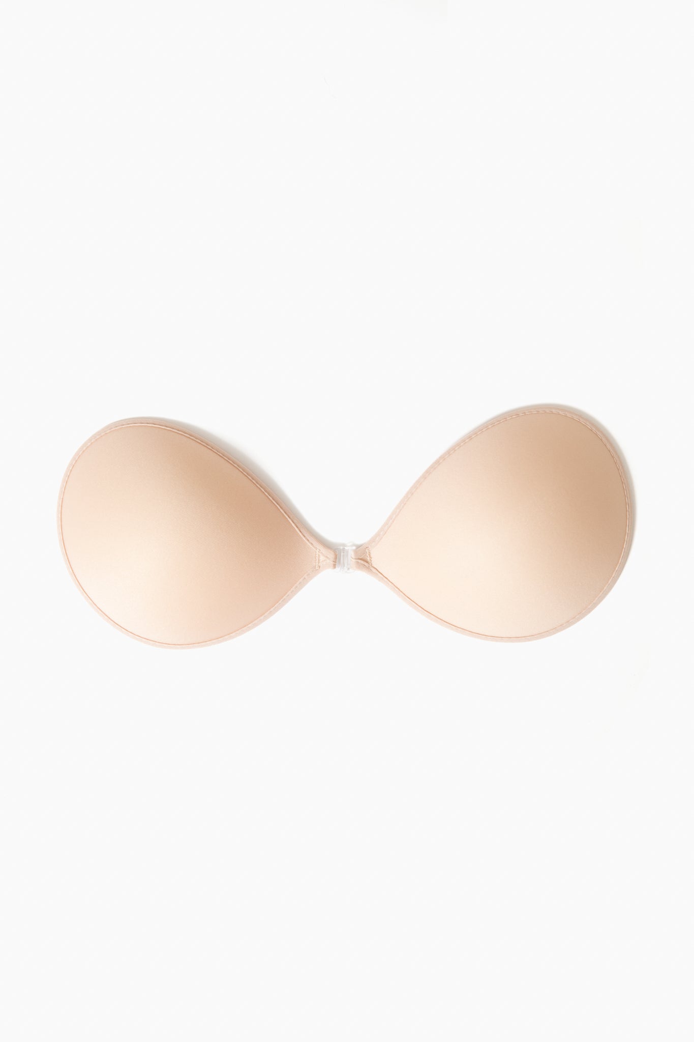 The NuBra strapless, backless adhesive bra features molded cups and a front clasp, offering seamless support under any outfit.