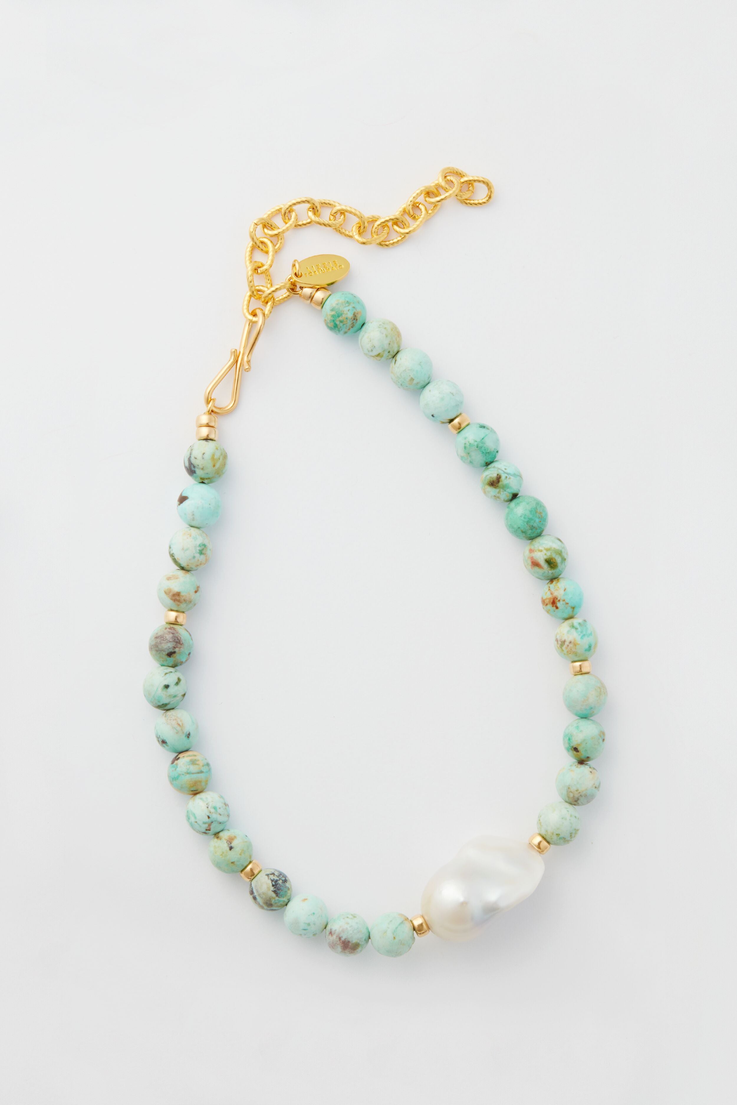 Lizzie Fortunato bracelet featuring round turquoise beads, a single large freshwater pearl, and a gold chain clasp.