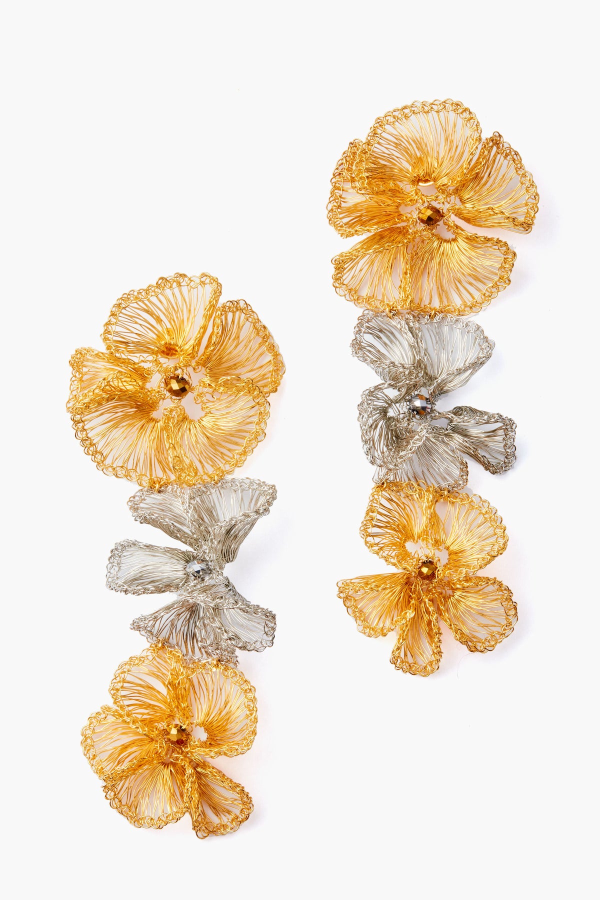 Lavish gold floral drop earrings feature delicate gold and silver wire flowers arranged vertically.