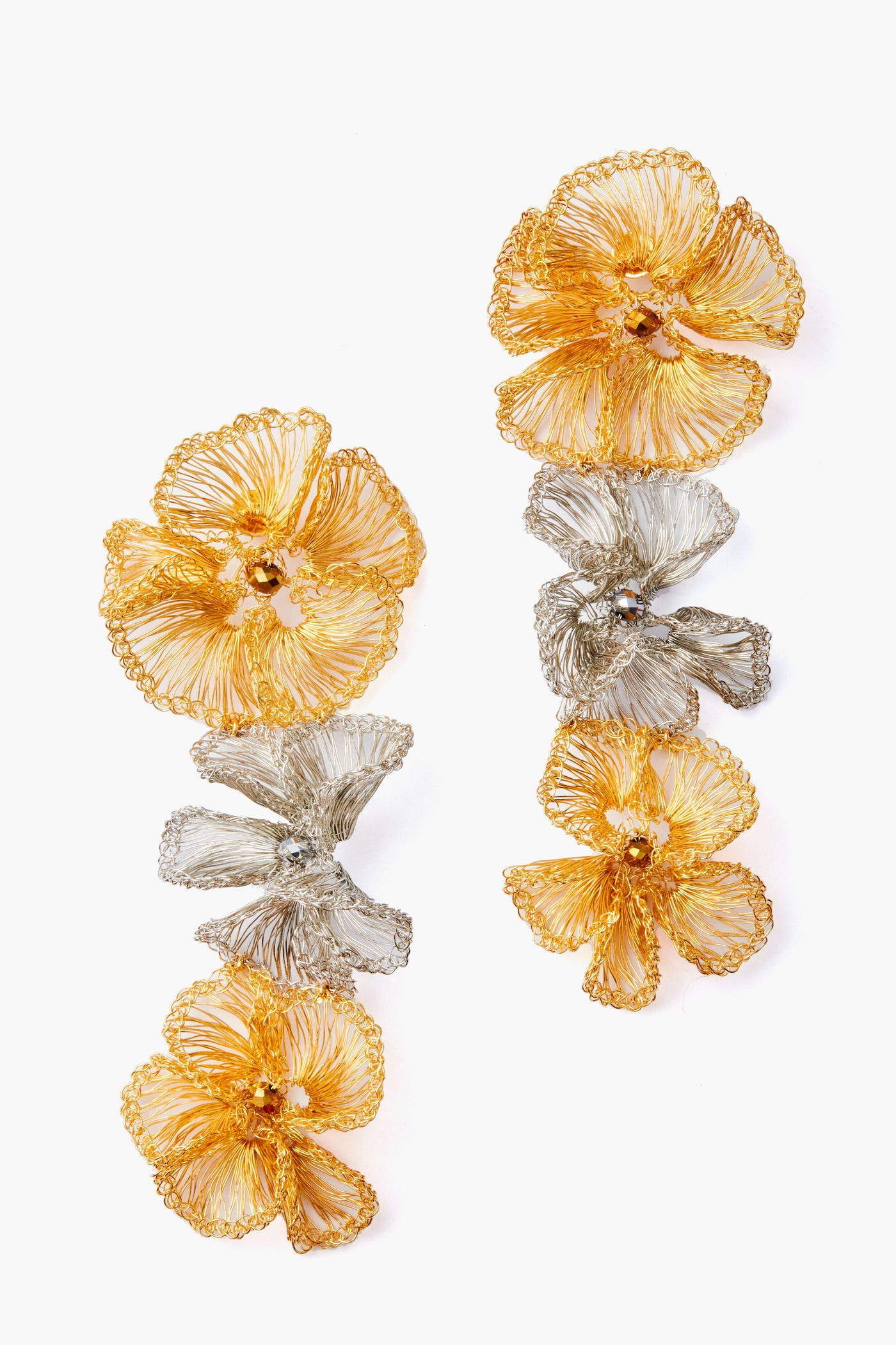 Lavish gold floral drop earrings feature delicate gold and silver wire flowers arranged vertically.
