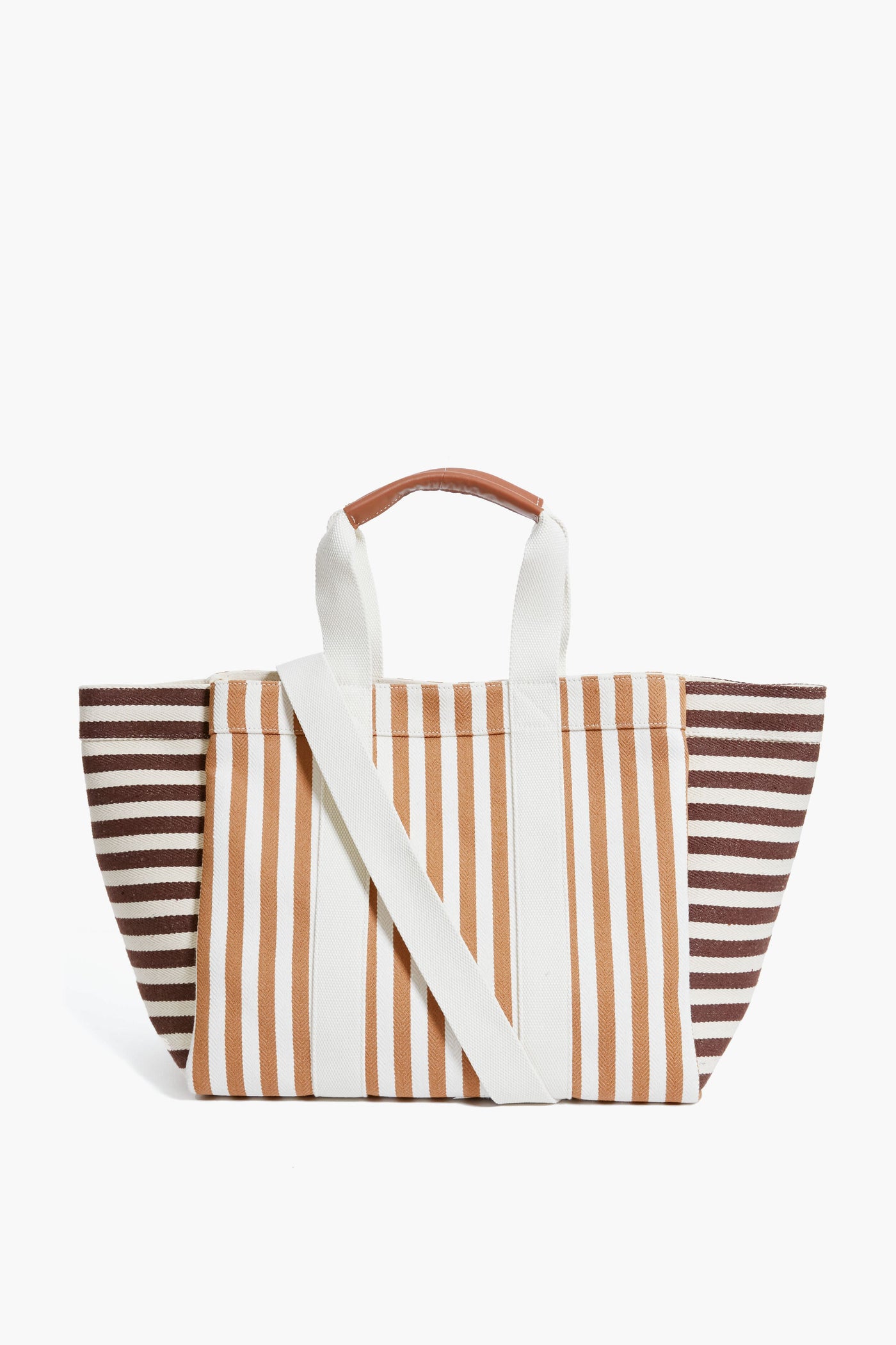 The Rue de Verneuil luxury tote bag features brown, beige, and white stripes, leather top handles with a brown grip, and a detachable shoulder strap.