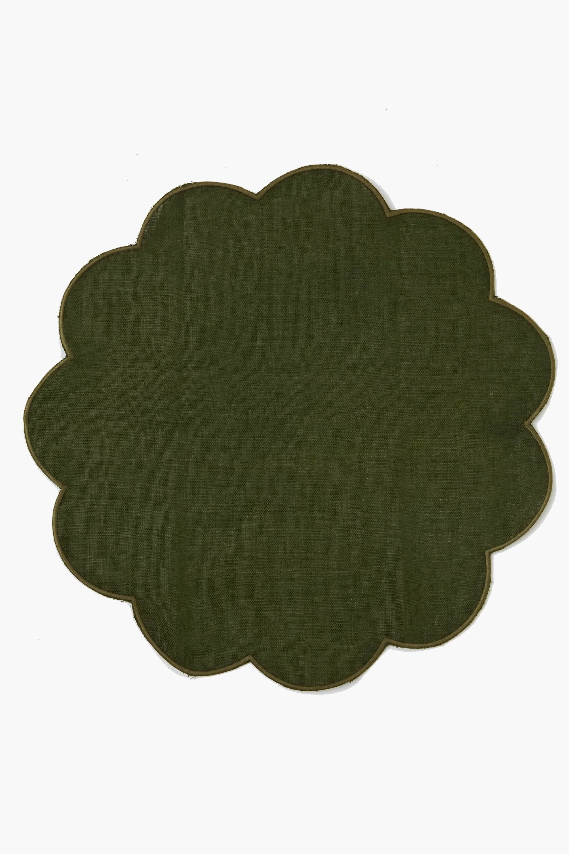 A dark green, flower-shaped placemat with scalloped edges—one of the elegant green scalloped placemats from Chefanie, perfect as a housewarming gift.