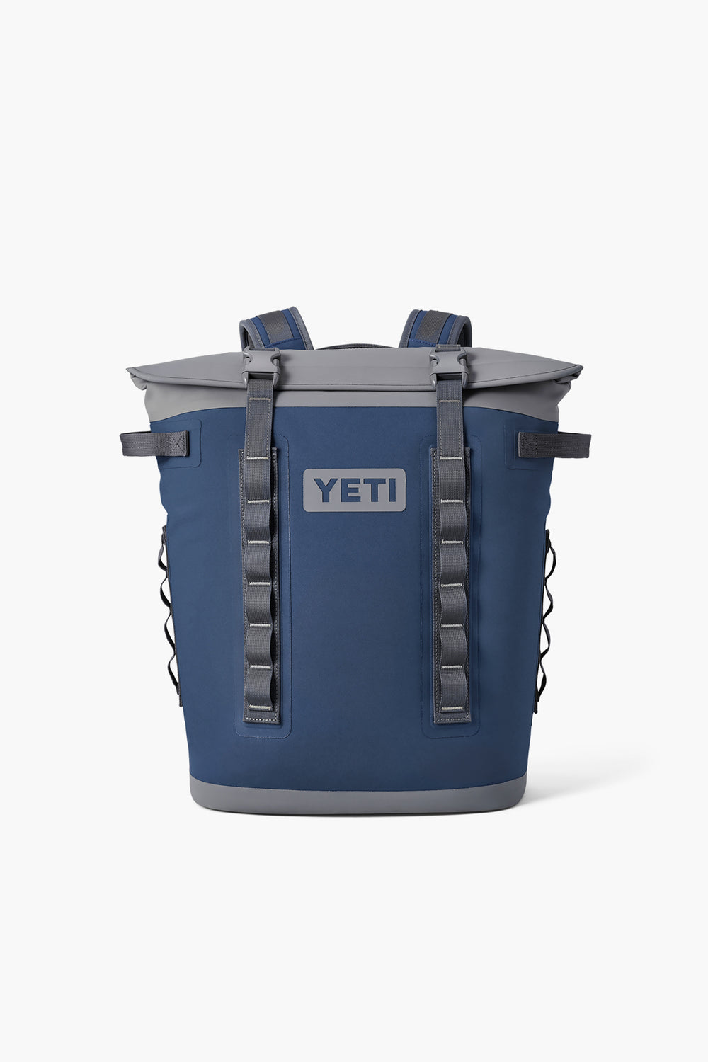 The YETI backpack cooler in blue features MagShield Access, backpack straps, multiple front loops, a gray top, and side pockets.