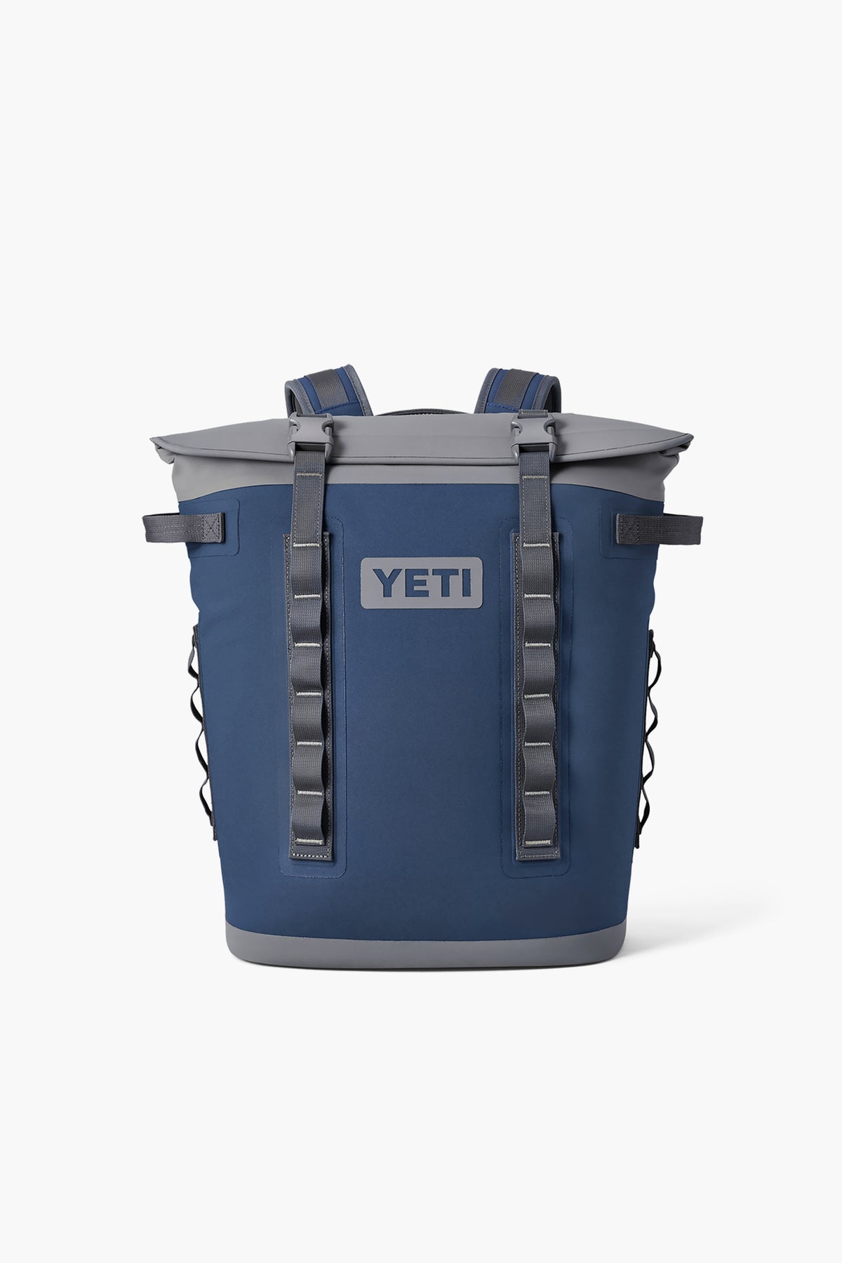 The YETI backpack cooler in blue features MagShield Access, backpack straps, multiple front loops, a gray top, and side pockets.
