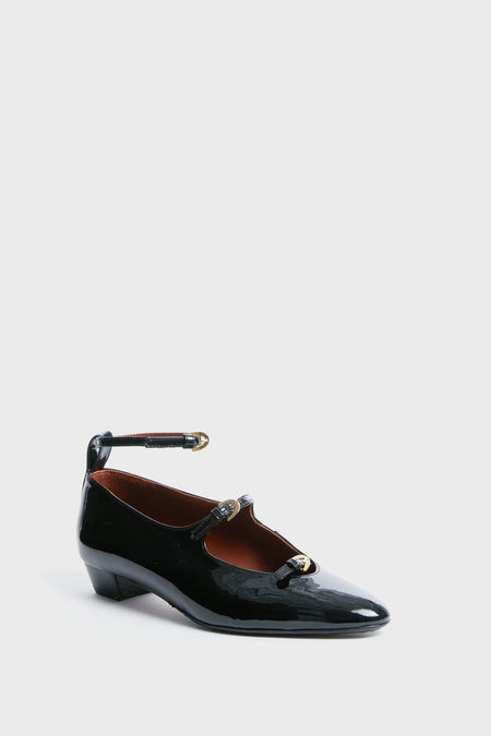 A di GAETA black patent leather Mary Jane with three thin straps, gold buckles, adjustable ankle strap, and a low chunky heel. Italian-made for elegance and comfort.
