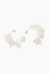 Mignonne Gavigan 18K gold-plated hoops featuring irregular translucent white stones and mother of pearl accents.