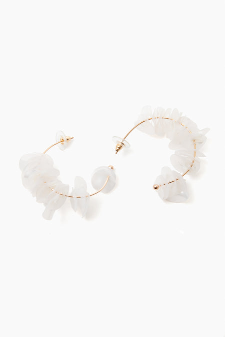 Mignonne Gavigan 18K gold-plated hoops featuring irregular translucent white stones and mother of pearl accents.