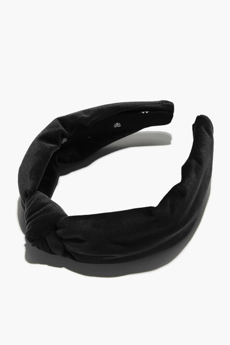 Lele Sadoughi black velvet padded headband with a twist knot detail.