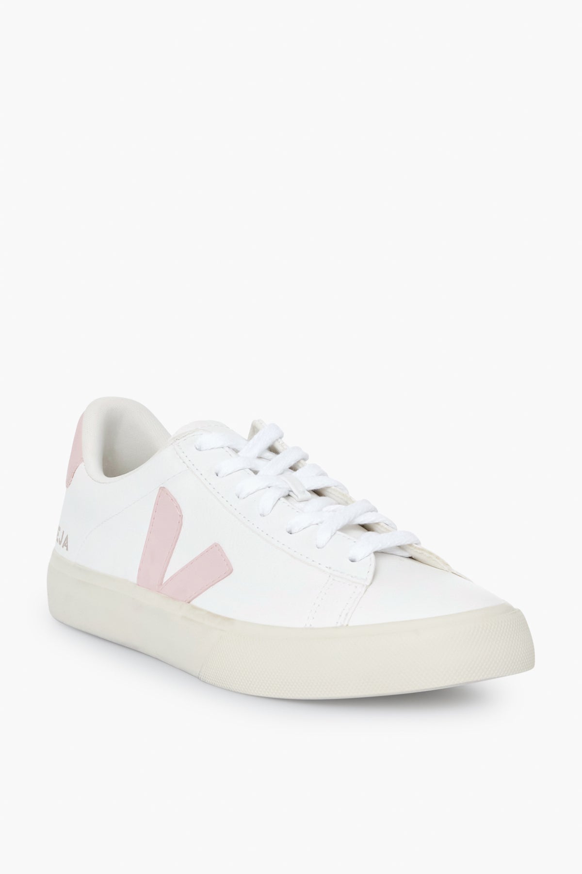 The VEJA low-top sneaker features a white upper, light pink detailing, white laces, and a beige rubber sole, showcasing the brand's stylish and sustainable design.