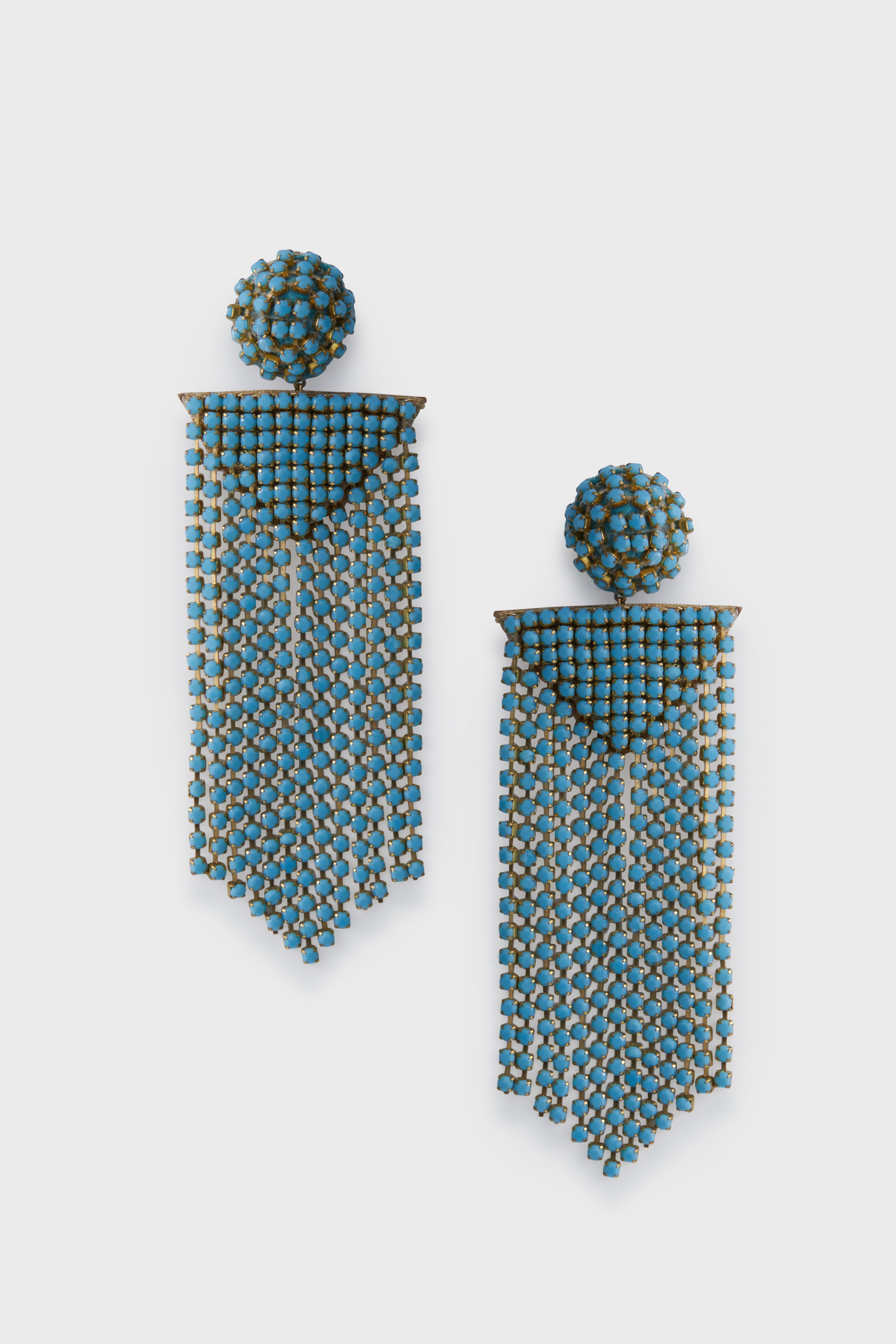 Deepa Gurnani Turquoise Fanning Earrings feature round blue beaded studs with long, cascading blue and gold fringe, inspired by Indian hand embroidery. Handcrafted for a bold statement look.