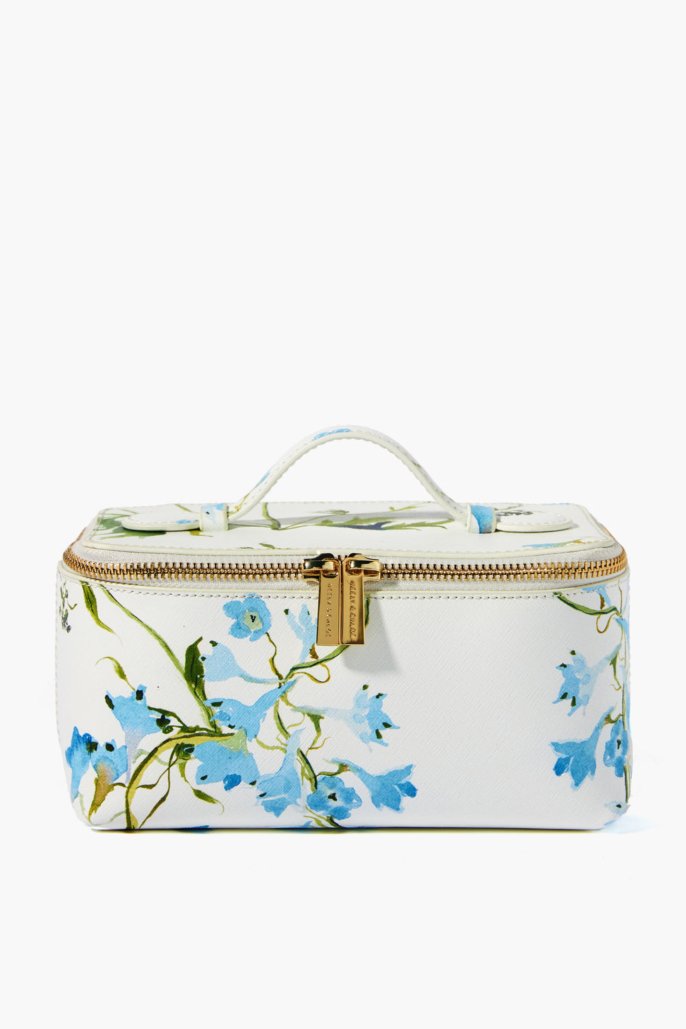 The Neely & Chloe x Inslee small rectangular white vanity case features blue floral prints, a top handle, and a gold zipper with dual pulls—perfect for gifting this holiday season.
