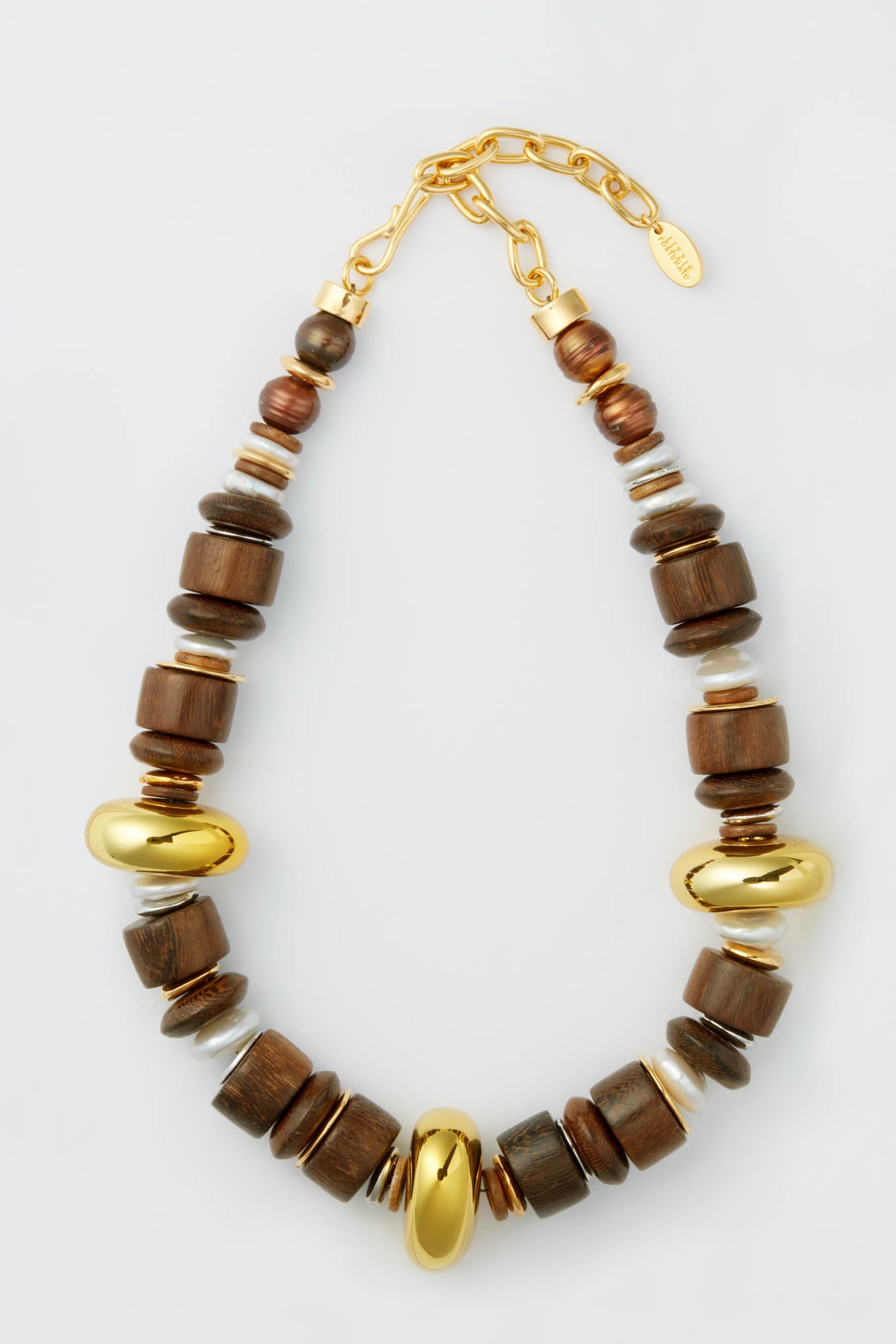 Lizzie Fortunato chunky mixed-medium necklace with large wooden beads, gold-toned metal beads, freshwater pearl beads, and an adjustable gold chain clasp.