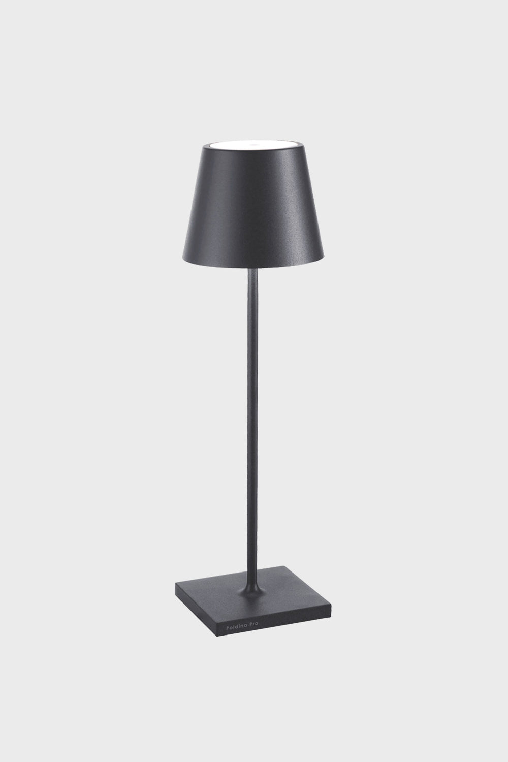 A black Zafferano Poldina Pro Table Lamp on a stand, featuring a rechargeable battery for cordless LED lighting convenience.