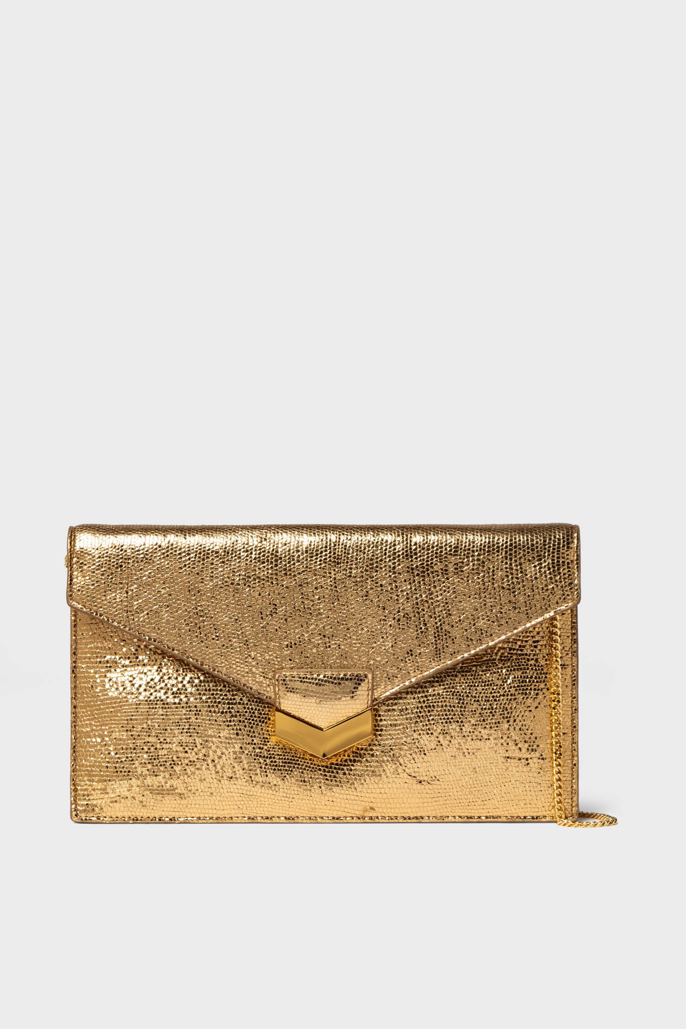 A rectangular gold Demellier London clutch with a textured sheepskin leather surface, envelope flap, and gold clasp.