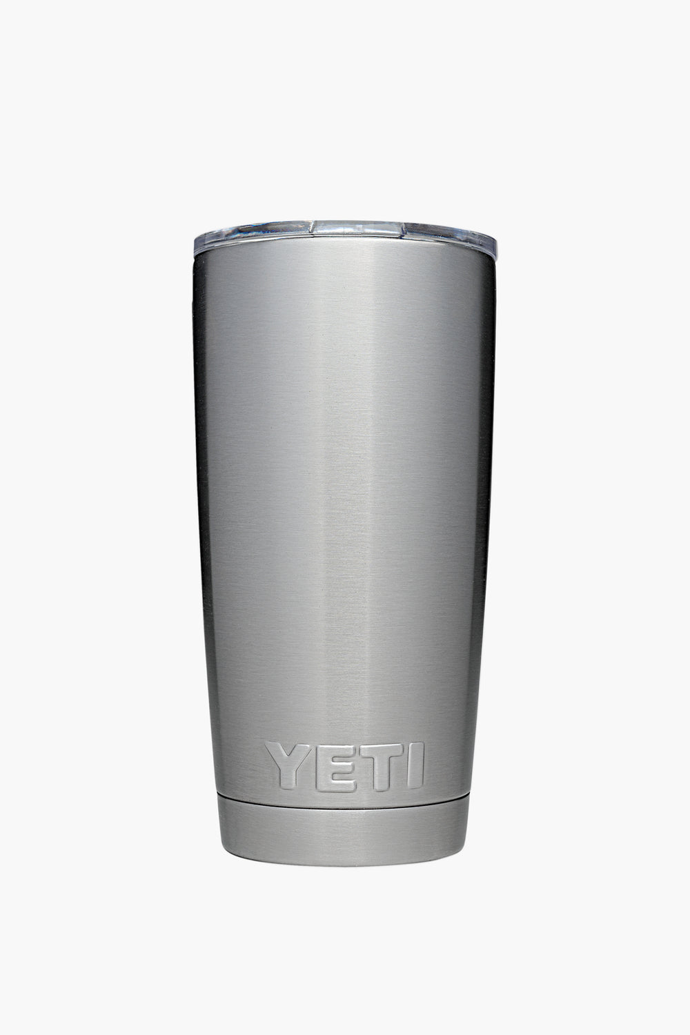 A YETI stainless steel tumbler with double-wall vacuum insulation and a transparent lid, shown standing upright.