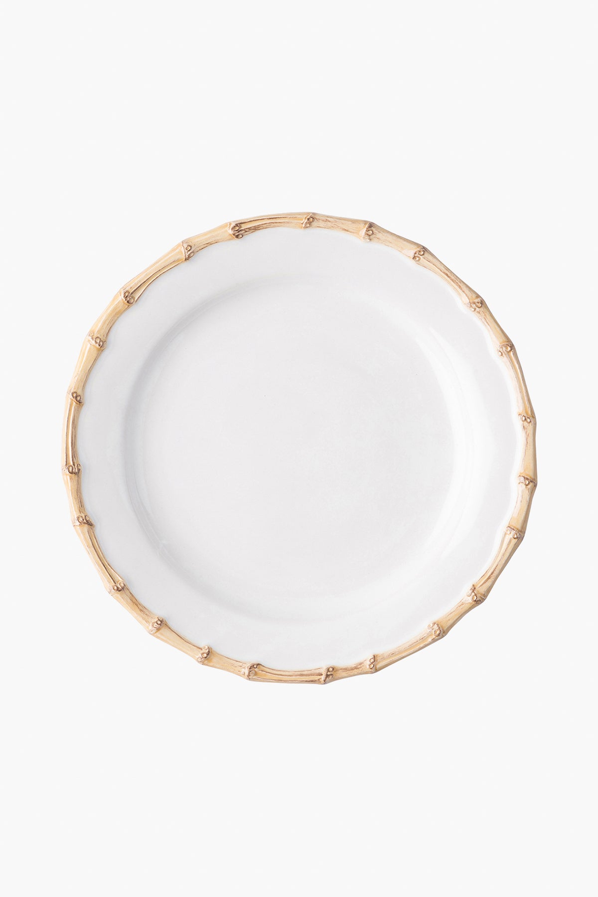 A white Juliska ceramic stoneware plate with a bamboo-inspired textured rim, viewed from above, brings elegance to any table setting.