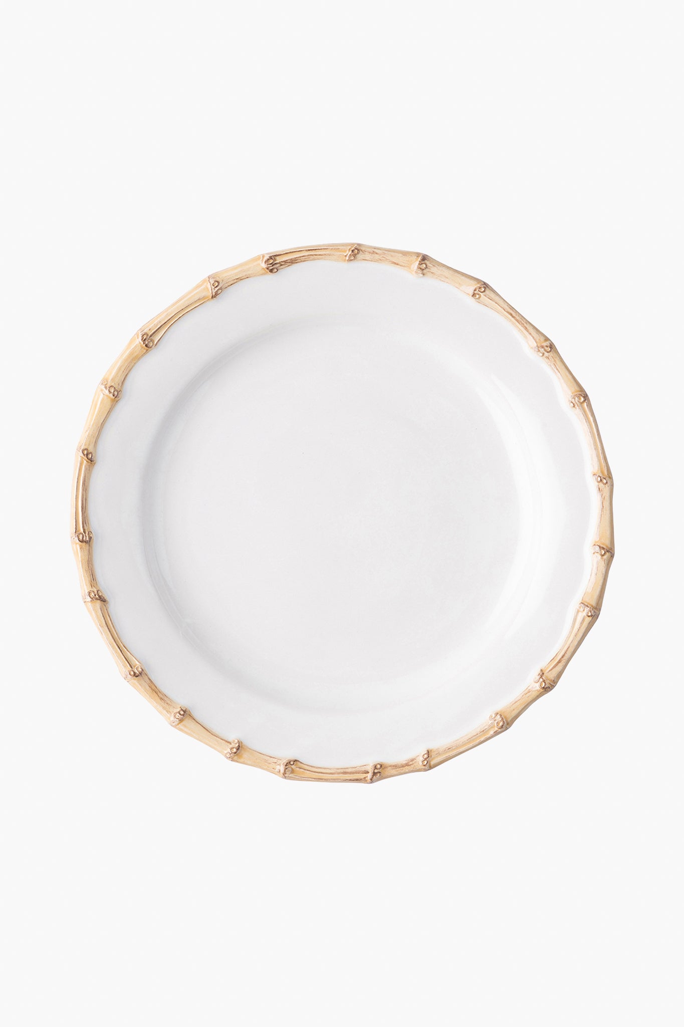 A white Juliska ceramic stoneware plate with a bamboo-inspired textured rim, viewed from above, brings elegance to any table setting.