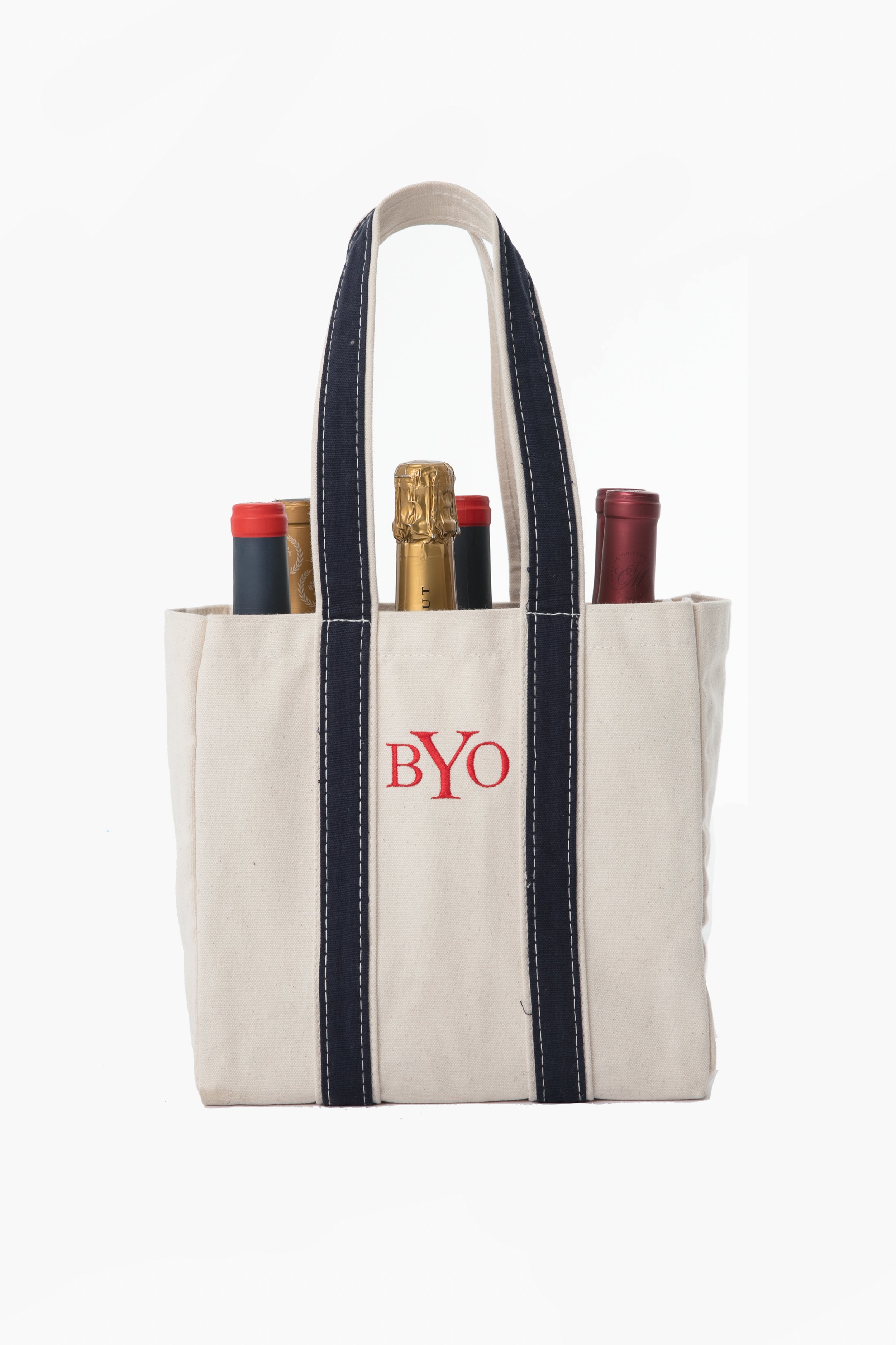 CB Station canvas wine carrier with navy handles and "BYO" embroidered on the front, holds four wine bottles.