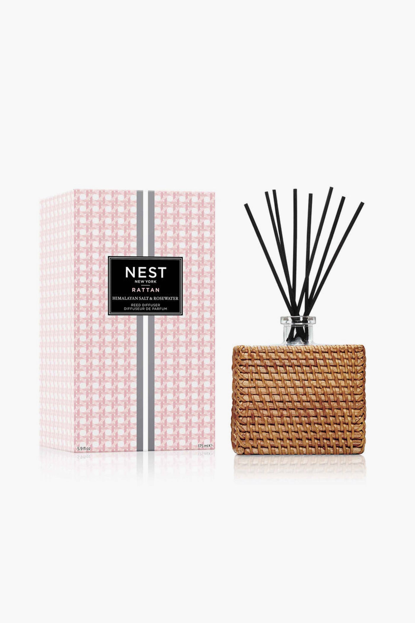 NEST New York Himalayan Salt & Rosewater Reed Diffuser, a cruelty-free home fragrance, is shown in its rattan holder next to the patterned pink and white box.