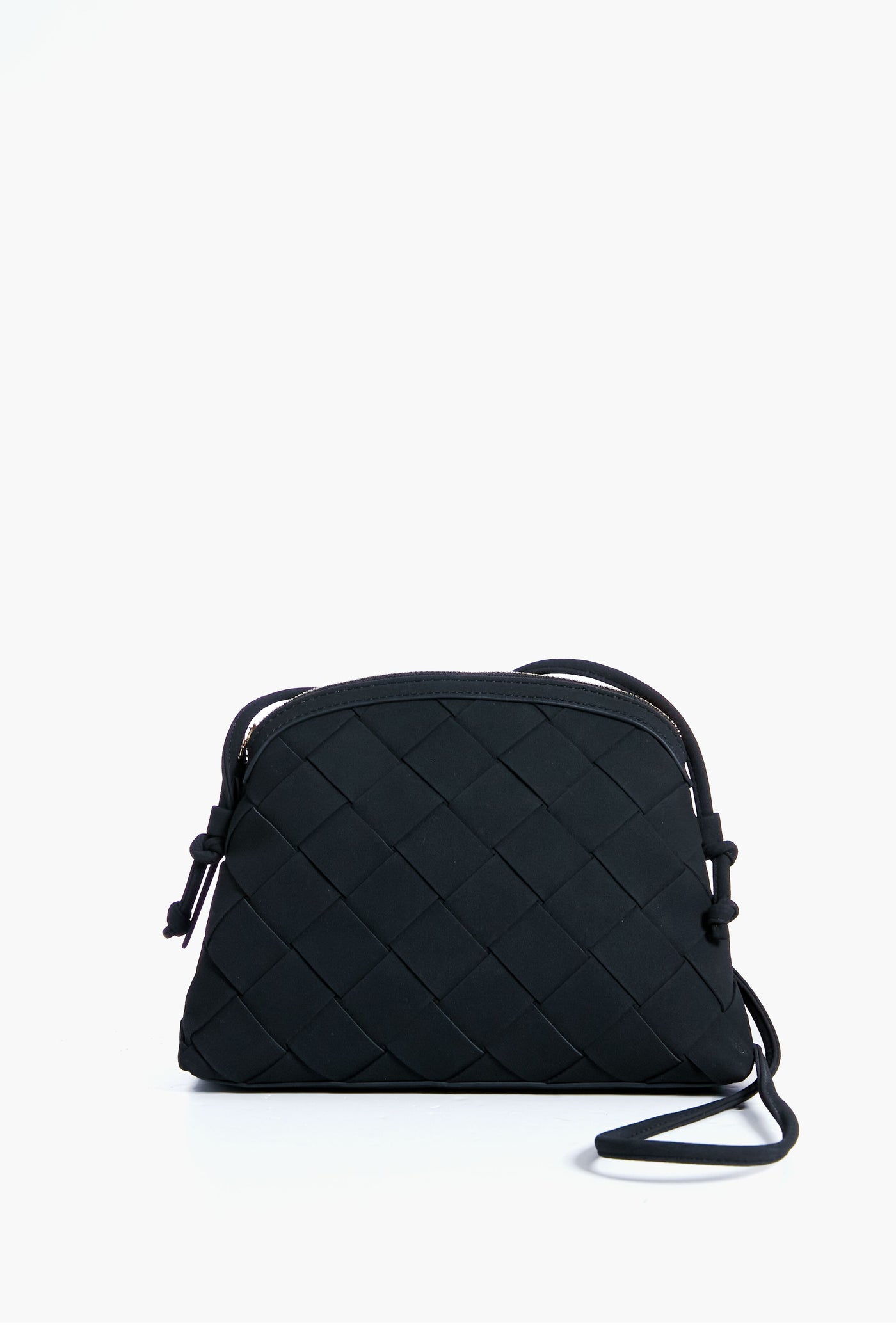 A black Moda Luxe Calista crossbody featuring a woven pattern, rounded top, and adjustable strap.