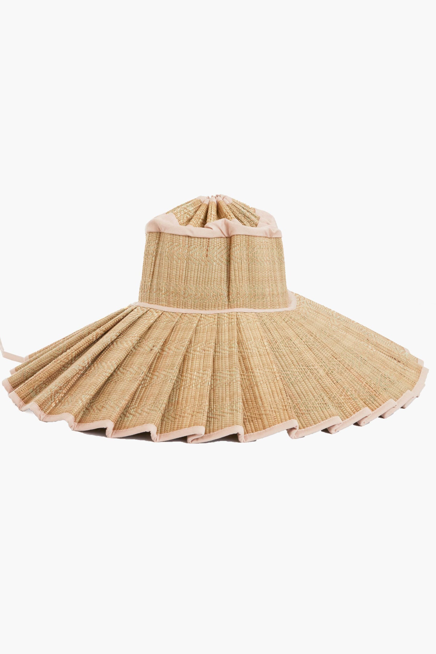 Lorna Murray travel-friendly wide-brimmed sun hat features pleated straw, light-colored trim, a unique structured design, and UPF 50+ sun protection.