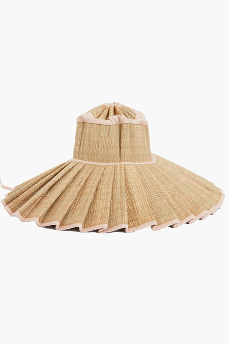 Lorna Murray travel-friendly wide-brimmed sun hat features pleated straw, light-colored trim, a unique structured design, and UPF 50+ sun protection.