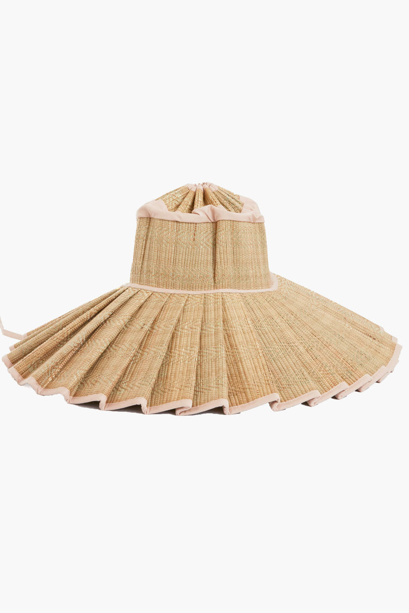 Lorna Murray travel-friendly wide-brimmed sun hat features pleated straw, light-colored trim, a unique structured design, and UPF 50+ sun protection.