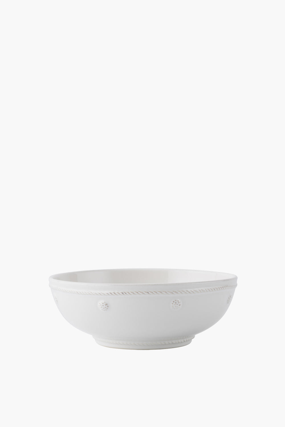 A Juliska ceramic stoneware Berry & Thread bowl features a plain white design with a subtle raised dotted and rope pattern around the rim.