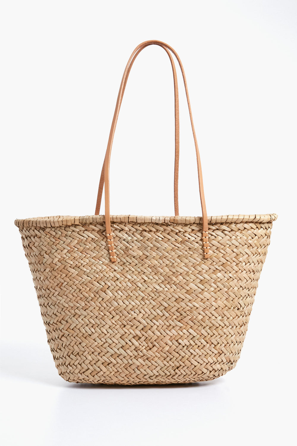 The Hat Attack Sorrento Tote is a woven straw bag with two long, thin leather handles—perfect for your next beach day.