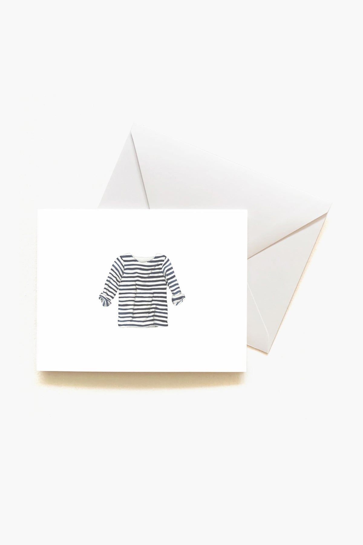 A Sara Fitz greeting card featuring a blue and white striped long-sleeve shirt illustration, paired with a white envelope—ideal for coastal stationery enthusiasts.
