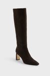 The Sam Edelman boot is a tall, chocolate brown suede knee-high style featuring a block heel and pointed toe.