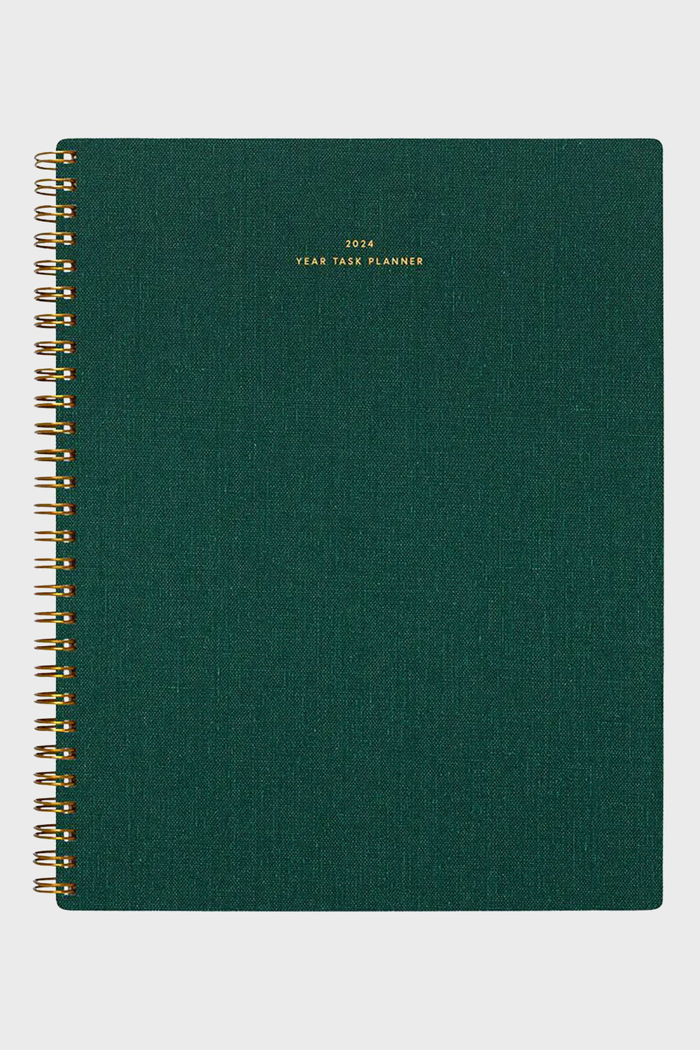 A 2024 yearly task planner from APPOINTED in hunter green with gold lettering on the cover and stylish spiral binding.