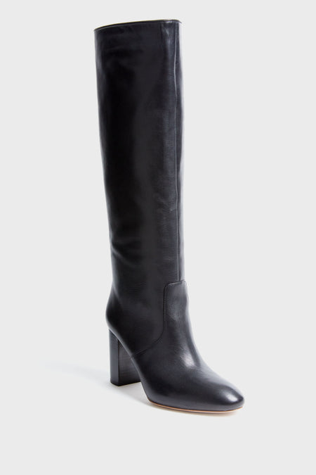 A single black Loeffler Randall knee-high leather boot is shown, featuring a rounded toe and block heel.