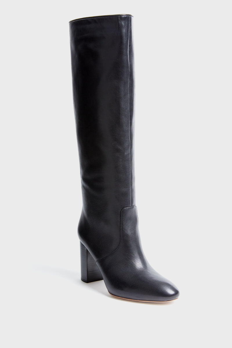 A single black Loeffler Randall knee-high leather boot is shown, featuring a rounded toe and block heel.