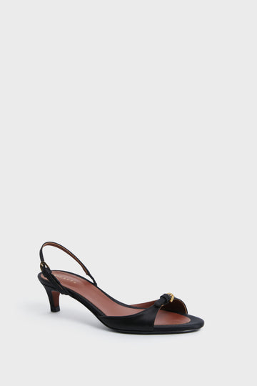 A di GAETA black open-toe slingback sandal with a low heel and gold-accented strap, inspired by Italian footwear.