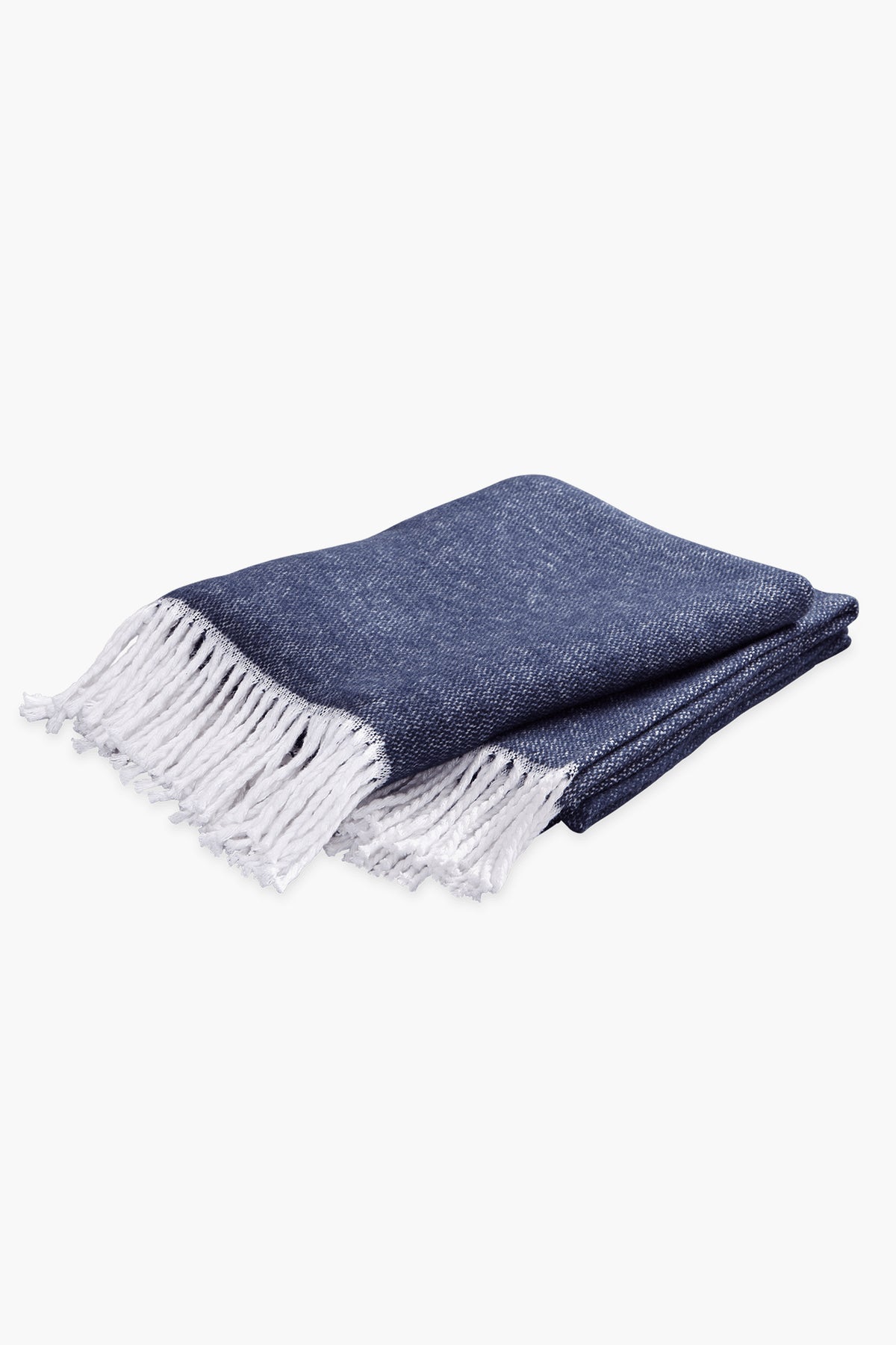 A folded Matouk Pezzo Throw in navy brushed cotton with a white fringe on one end, displayed on a plain white background.