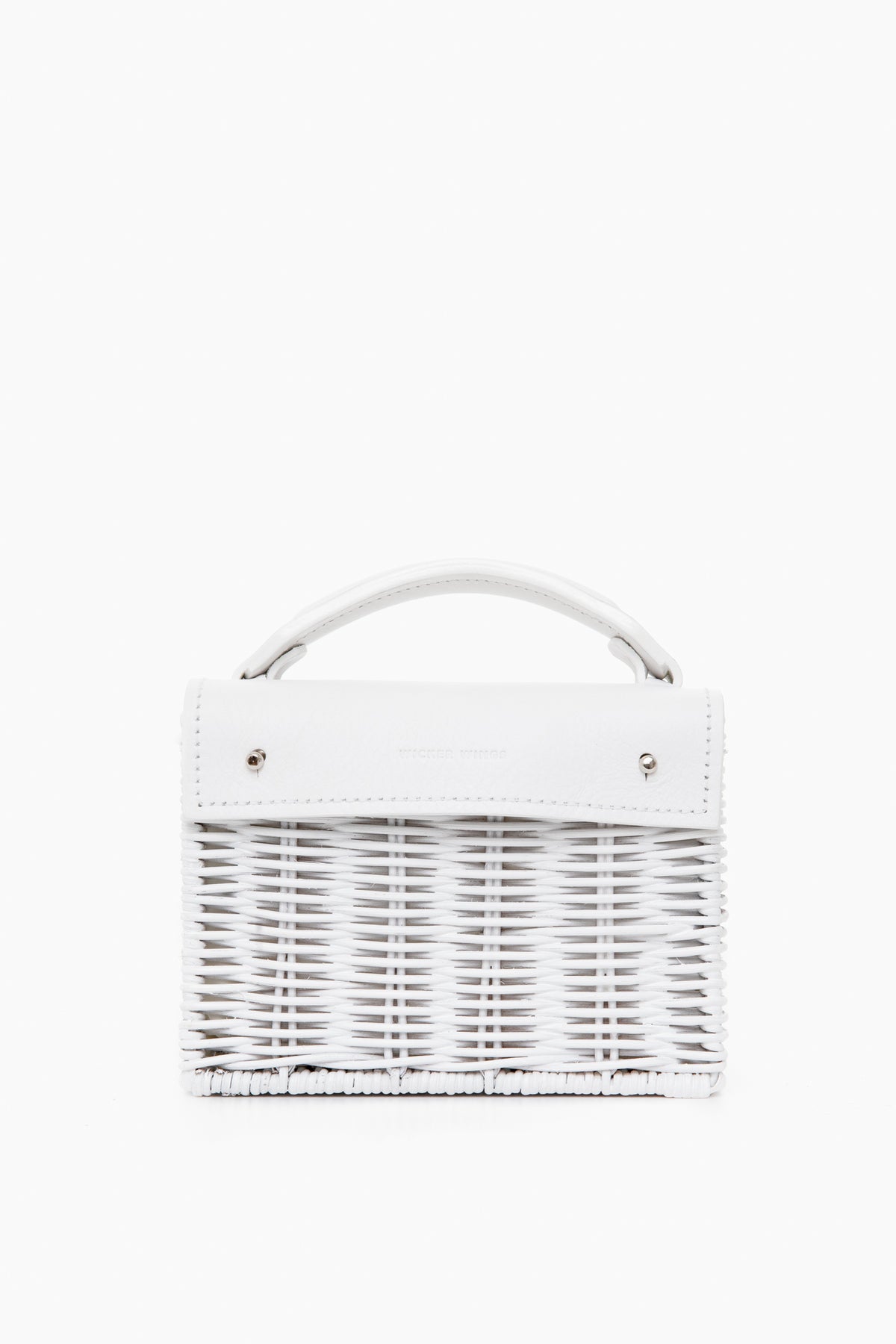 A handmade small white woven bag by Wicker Wings, crafted from sustainable materials with a short top handle and silver hardware.