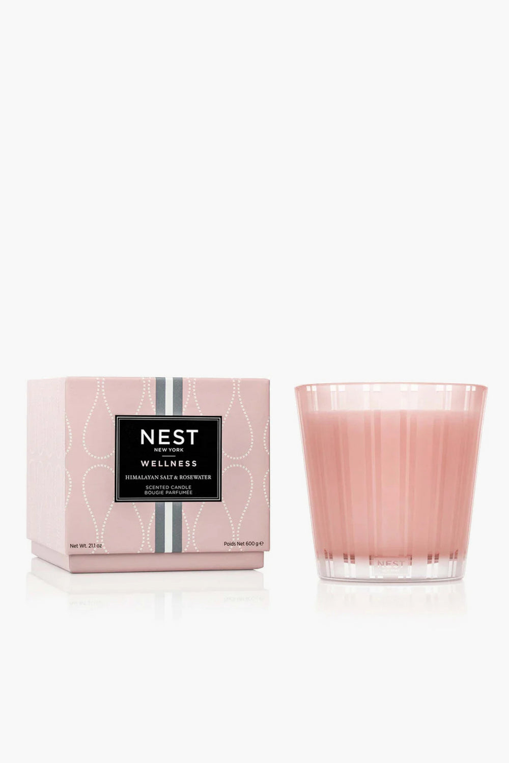 A pink NEST New York 3 Wick Candle with a box labeled "Himalayan Salt & Rosewater" is displayed, offering a luxurious home fragrance.