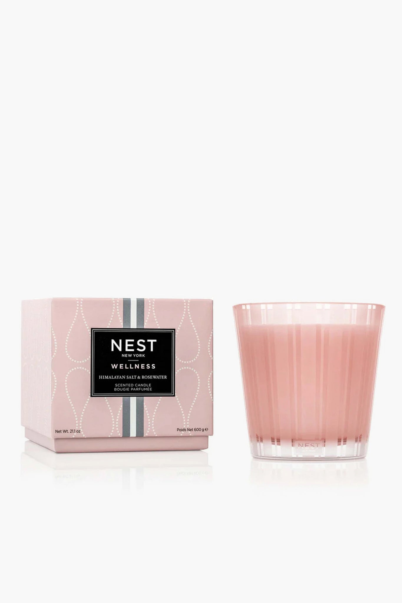 A pink NEST New York 3 Wick Candle with a box labeled "Himalayan Salt & Rosewater" is displayed, offering a luxurious home fragrance.