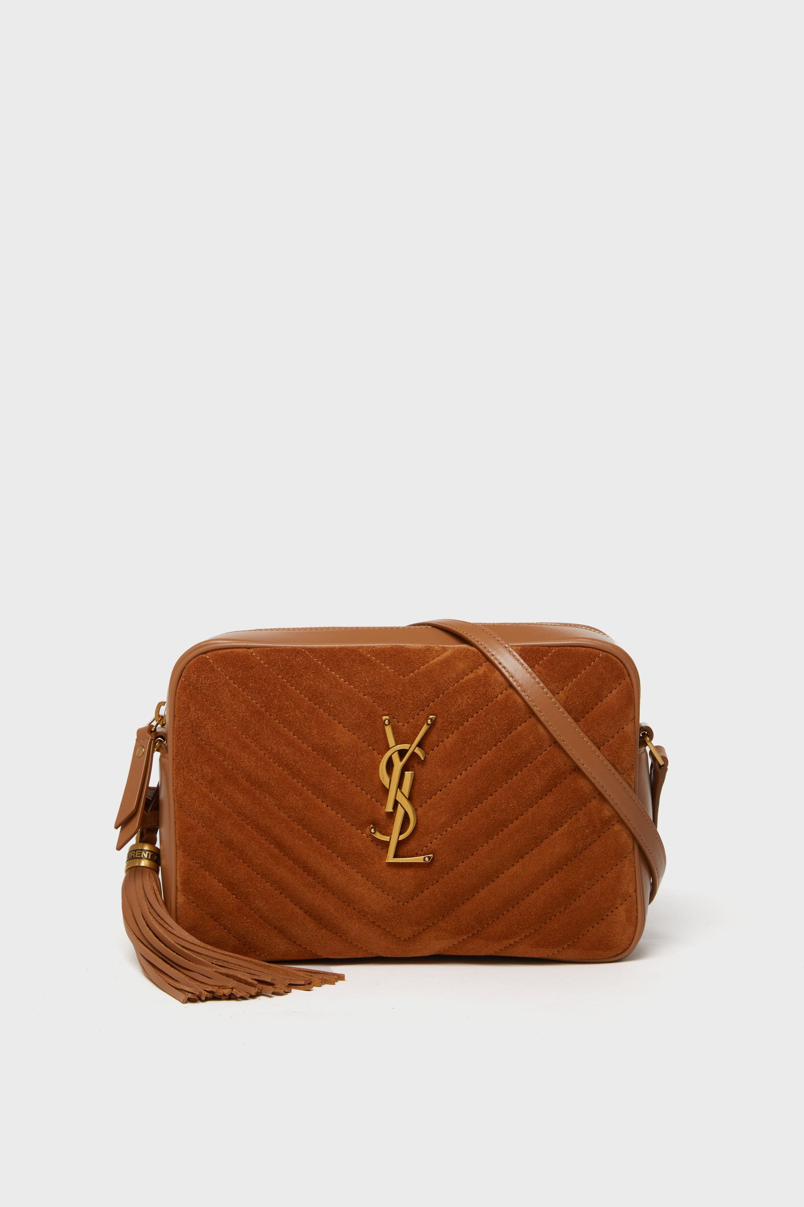 Brown suede chevron-quilted crossbody from Tuckernuck Archive Collection featuring a leather strap and side tassel detail.