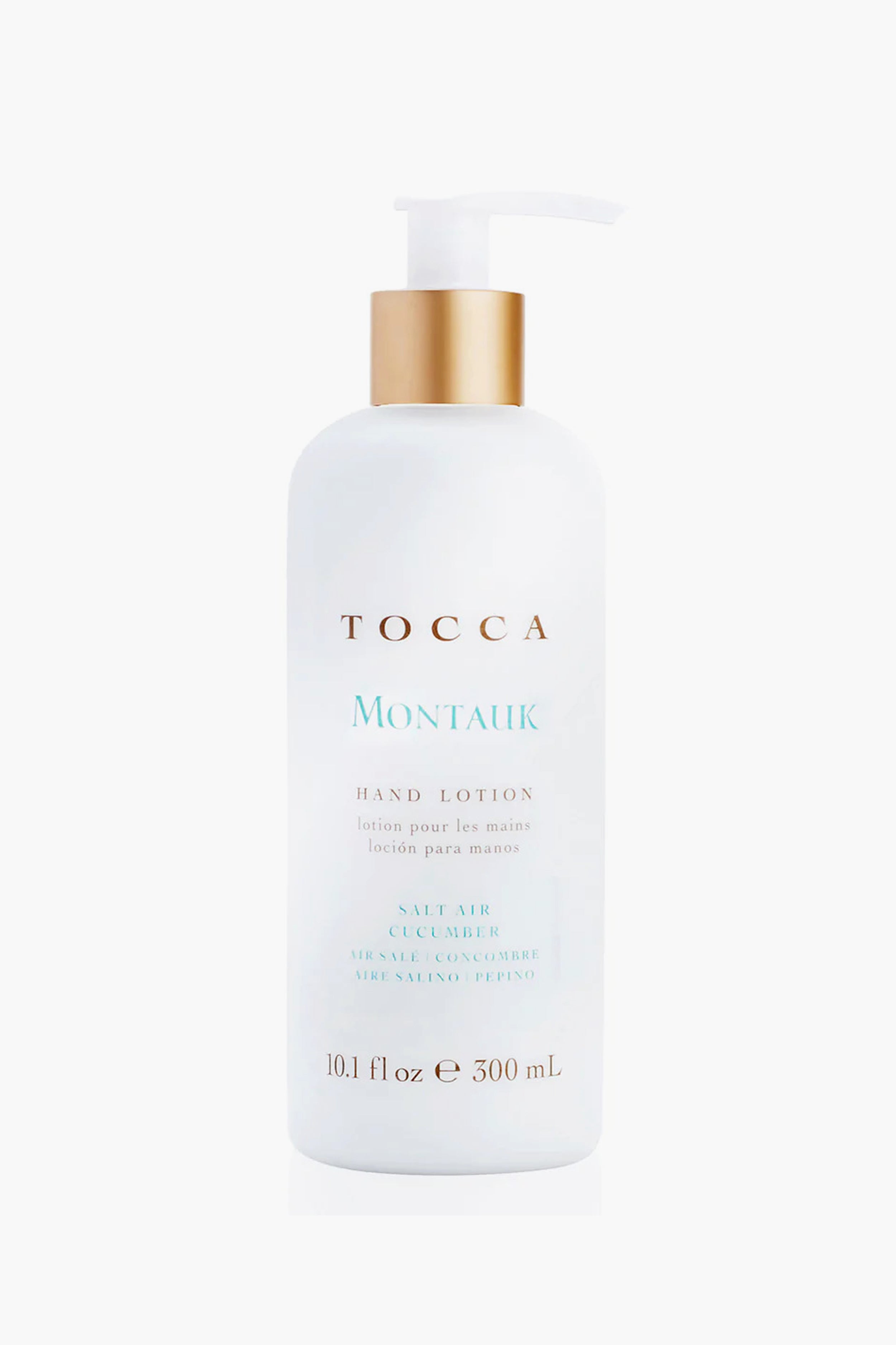 A white Tocca hand lotion bottle with a pump, salt air cucumber scent, 10.1 fl oz (300 mL), enriched with natural ingredients.